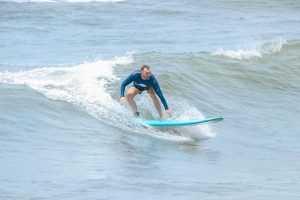 A man who is surfing on the waves in the ocean