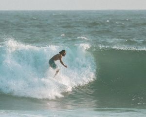 A man is surfing in the waves