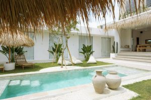 A view of the interior of the Bali Surf Camp Kavomaison shows a clean swimming pool