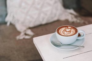 Cup of coffee with latte art on the table