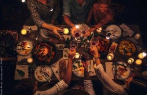 A group of people or friends enjoying dinner together