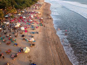 Aerial view of a busy sandy beach
