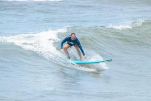 A man who is surfing