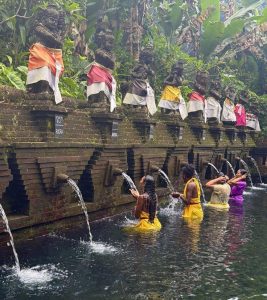 Hindus performing a ritual of physical or spiritual purification known as Melukat at a purification pool