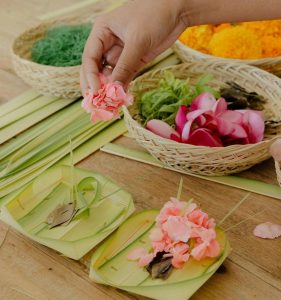 The process of making Canang Sari, a type of daily offering made by Hindus in Bali