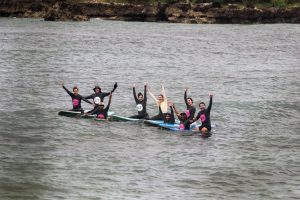 Group surfing lessons, held at a surf camp