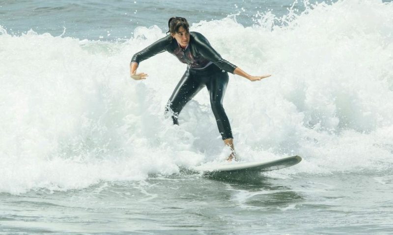 a woman surfing in the sea